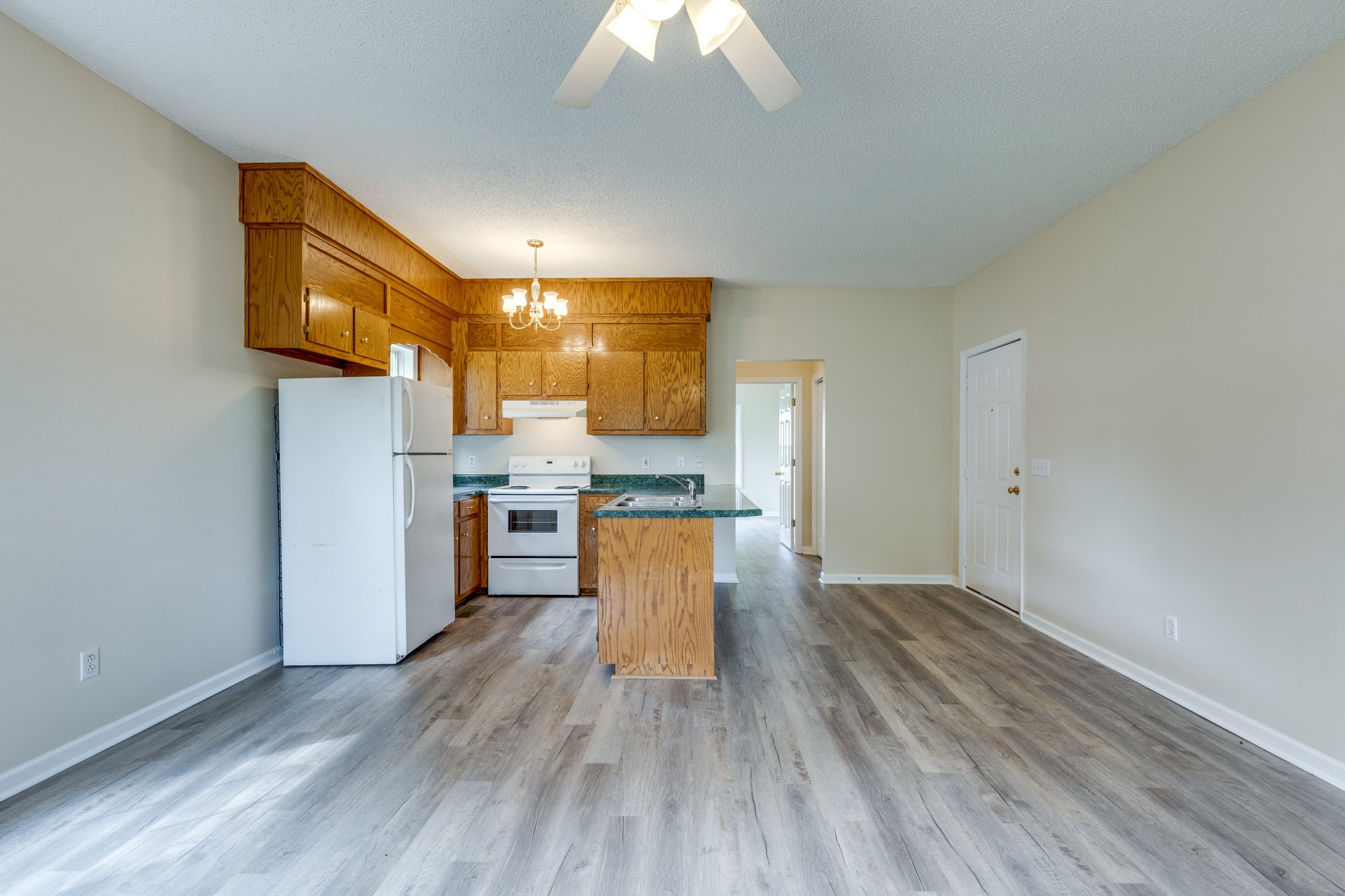 225 Locust Street Pulaski, TN 38478 - Photo 14 of 44 a view of kitchen and wooden floor