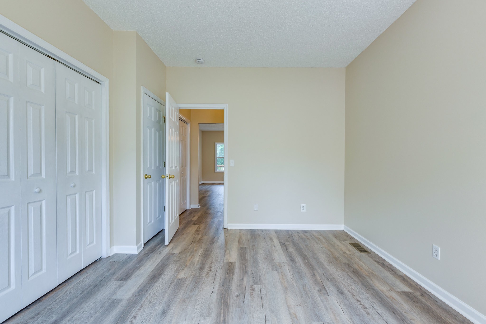 225 Locust Street Pulaski, TN 38478 - Photo 21 of 44 a view of a hallway with wooden floor