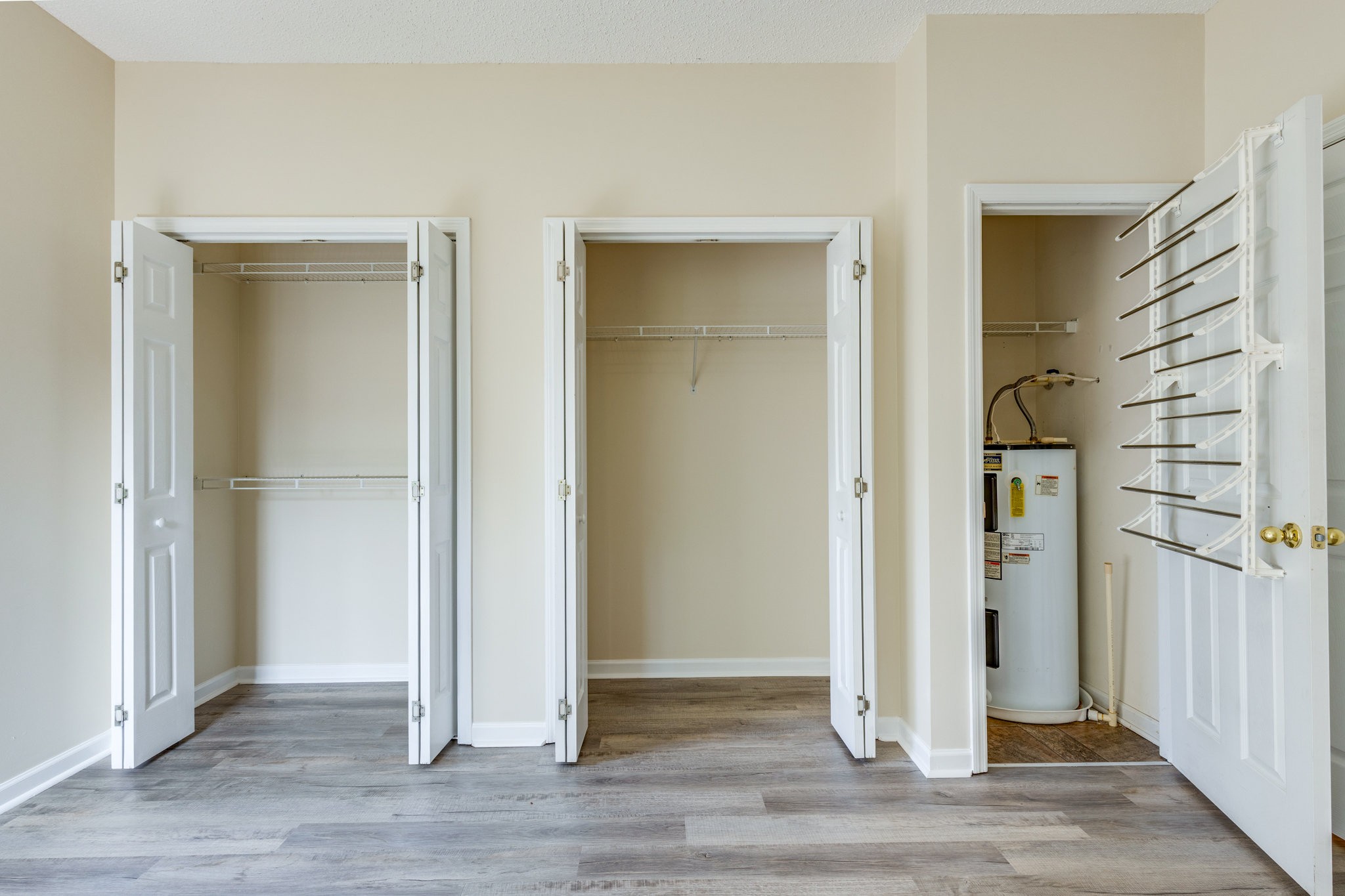 225 Locust Street Pulaski, TN 38478 - Photo 22 of 44 an empty room with wooden floor and entrance