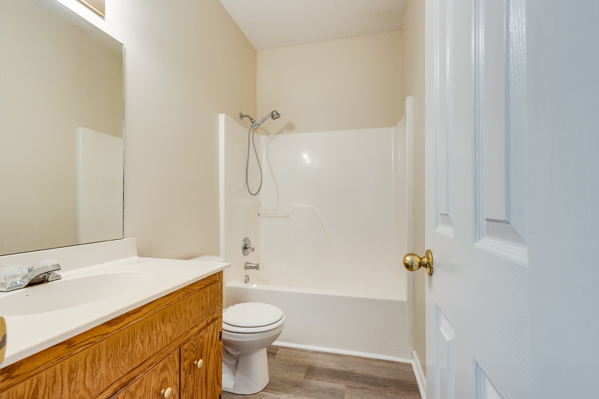 225 Locust Street Pulaski, TN 38478 - Photo 25 of 44 a bathroom with a sink a toilet and shower