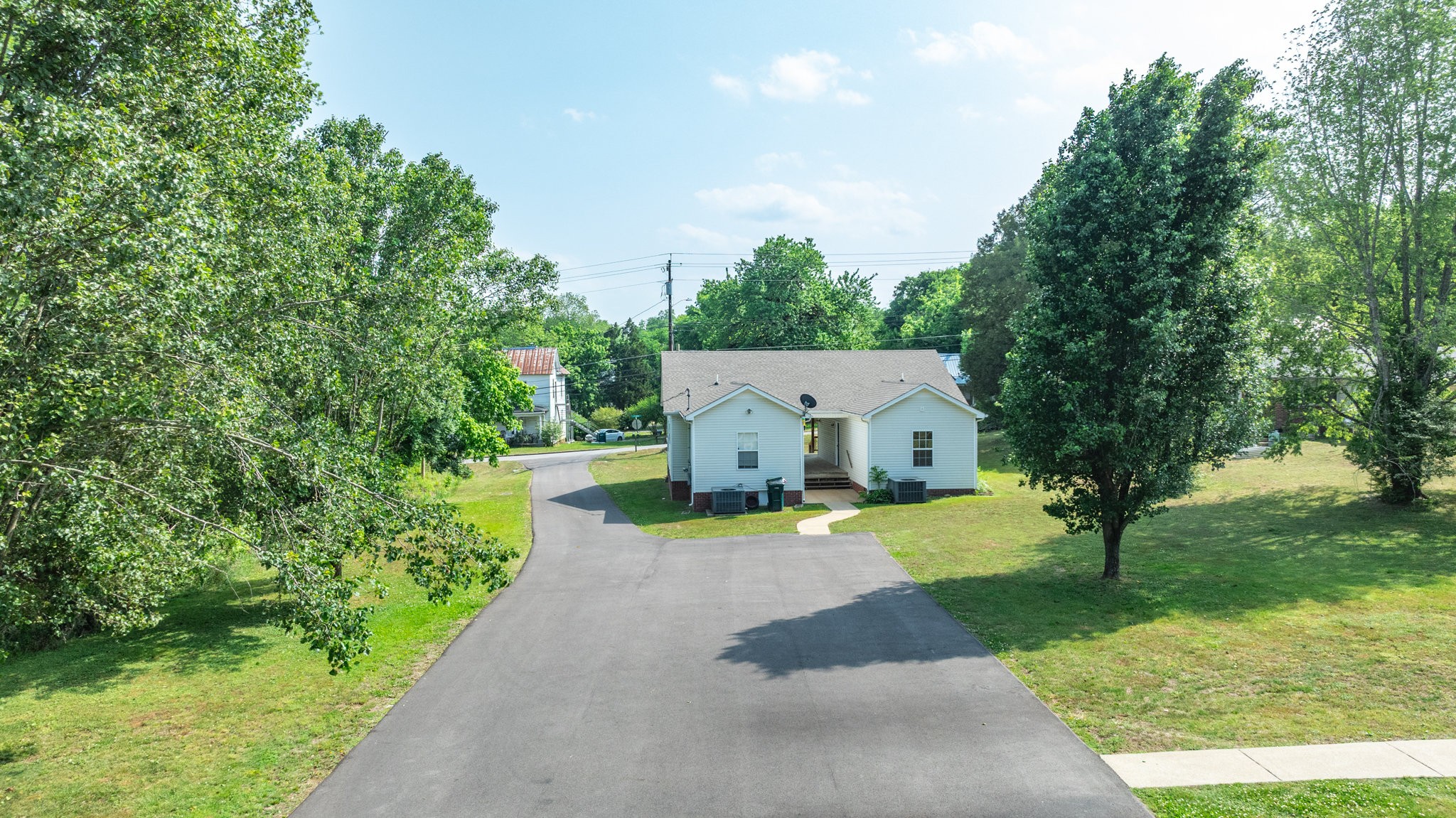 225 Locust Street Pulaski, TN 38478 - Photo 3 of 44 a front view of a house with garden