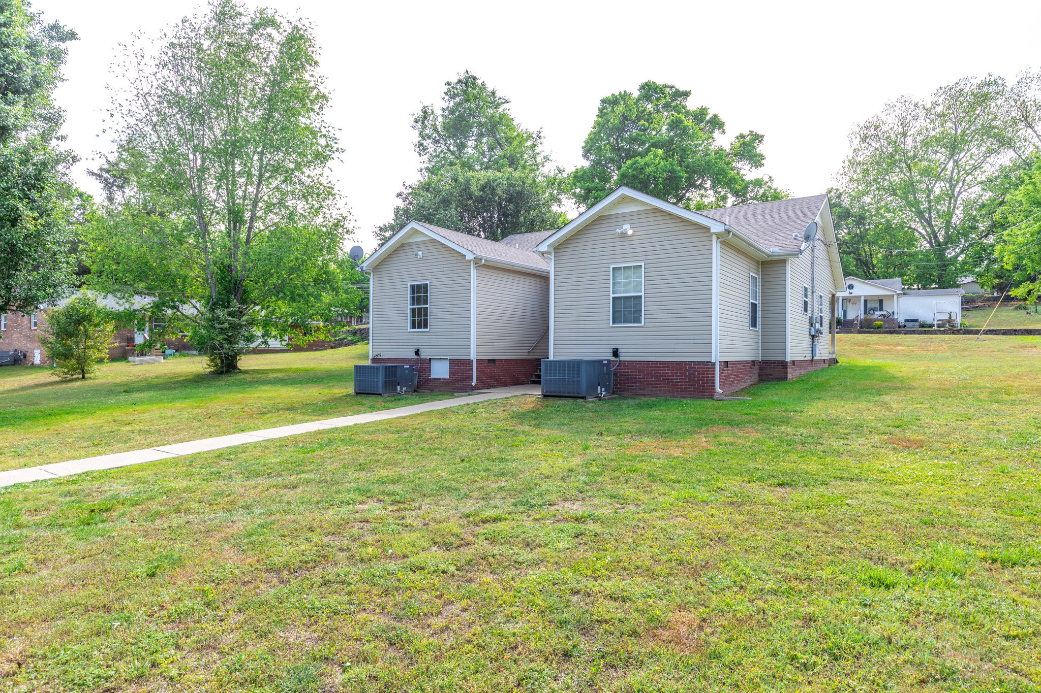 225 Locust Street Pulaski, TN 38478 - Photo 32 of 44 a view of a house with a yard and trees