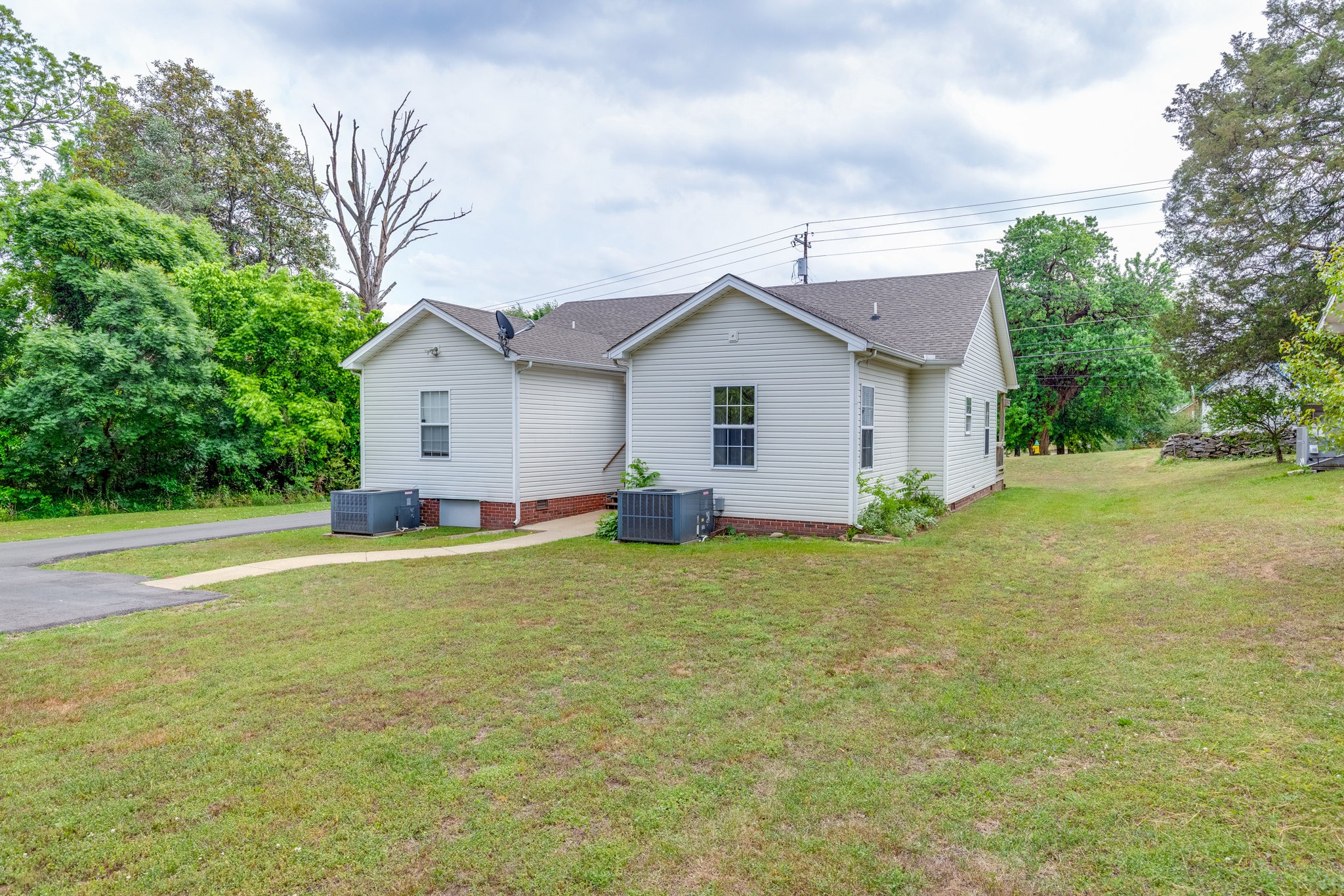 225 Locust Street Pulaski, TN 38478 - Photo 33 of 44 a view of a house with a yard and garage