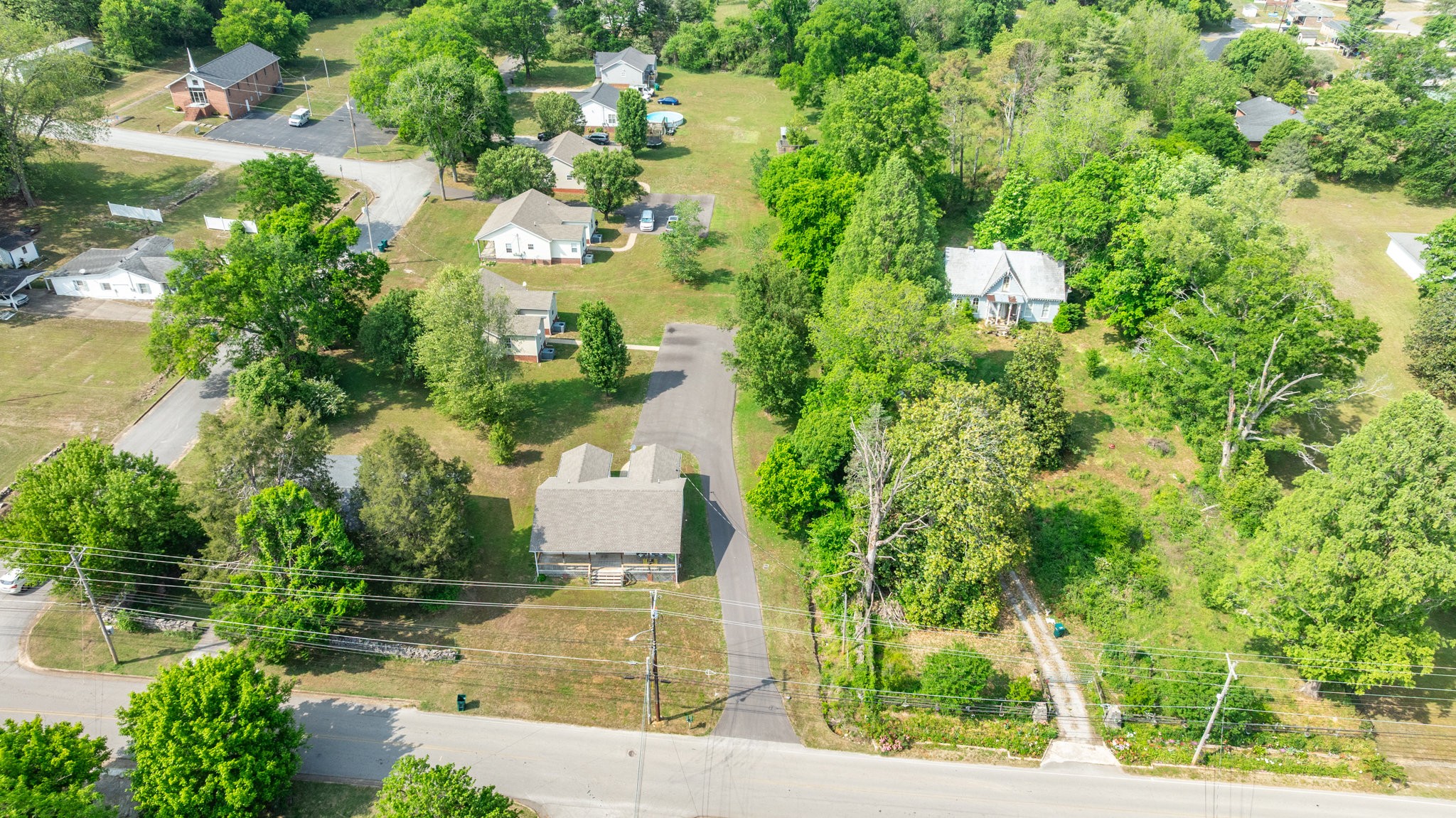 225 Locust Street Pulaski, TN 38478 - Photo 41 of 44 an aerial view of a house with swimming pool and garden
