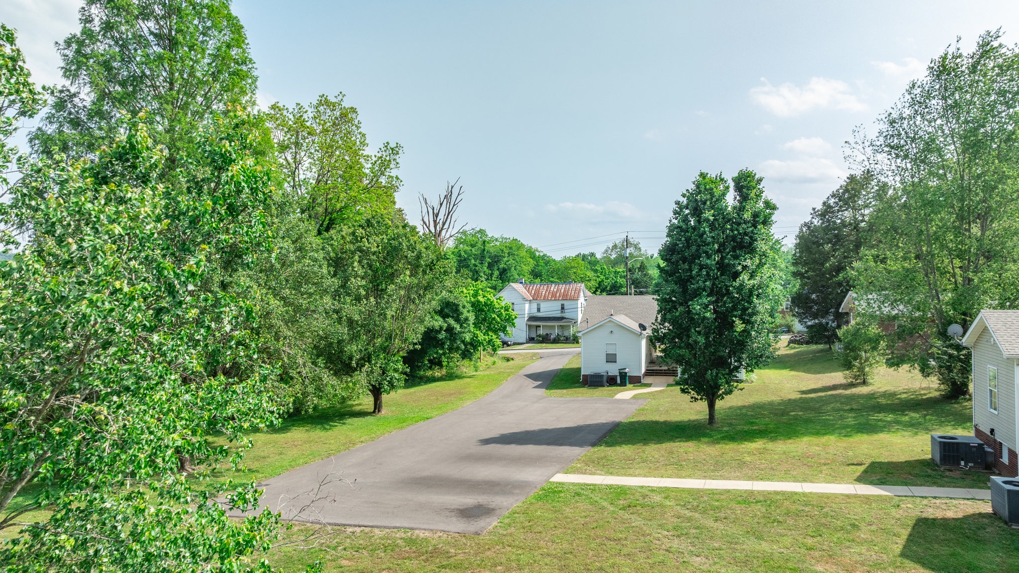 225 Locust Street Pulaski, TN 38478 - Photo 44 of 44 a view of a backyard with a garden