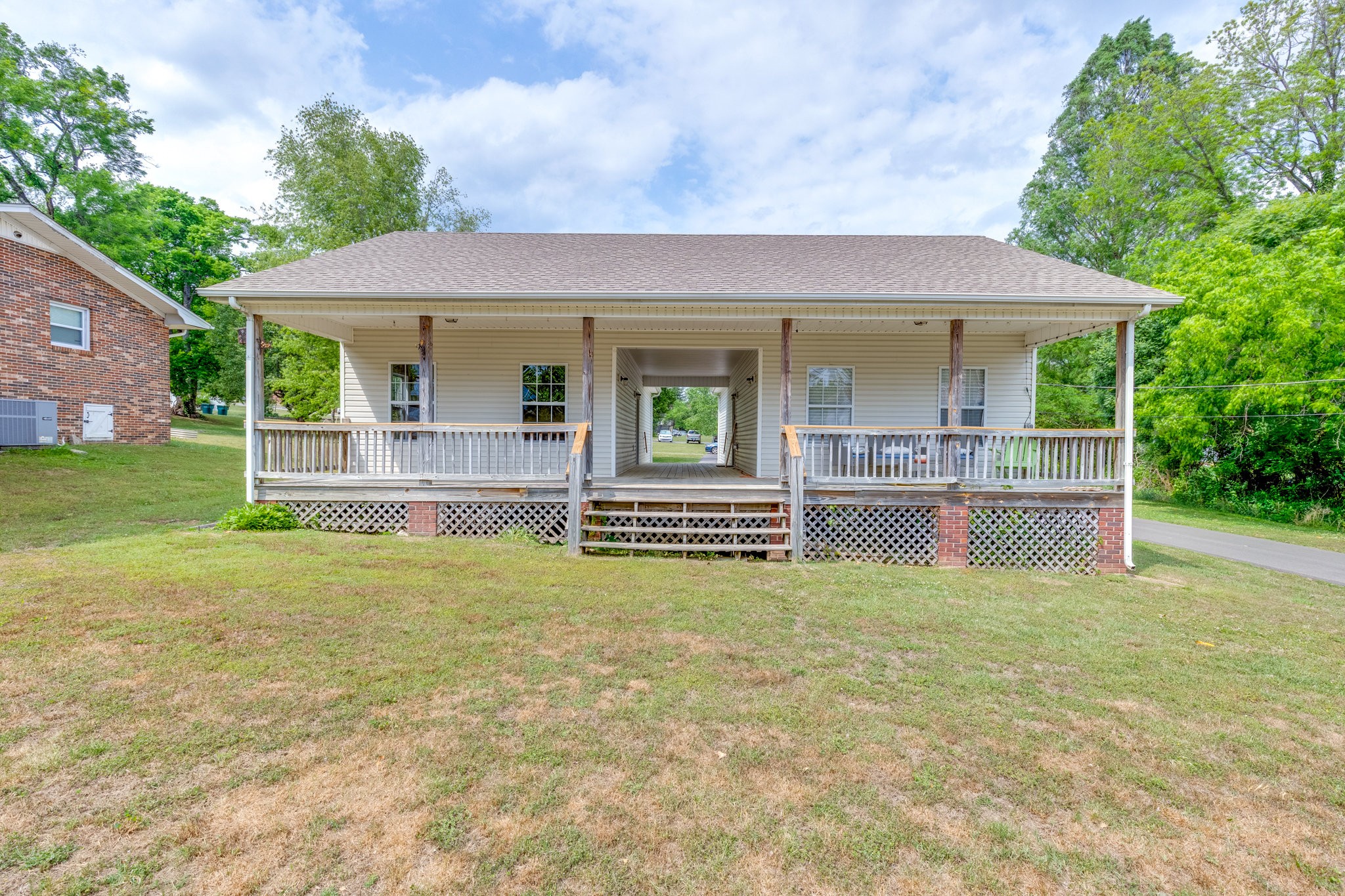 225 Locust Street Pulaski, TN 38478 - Photo 5 of 44 a view of a house with a yard porch and sitting area