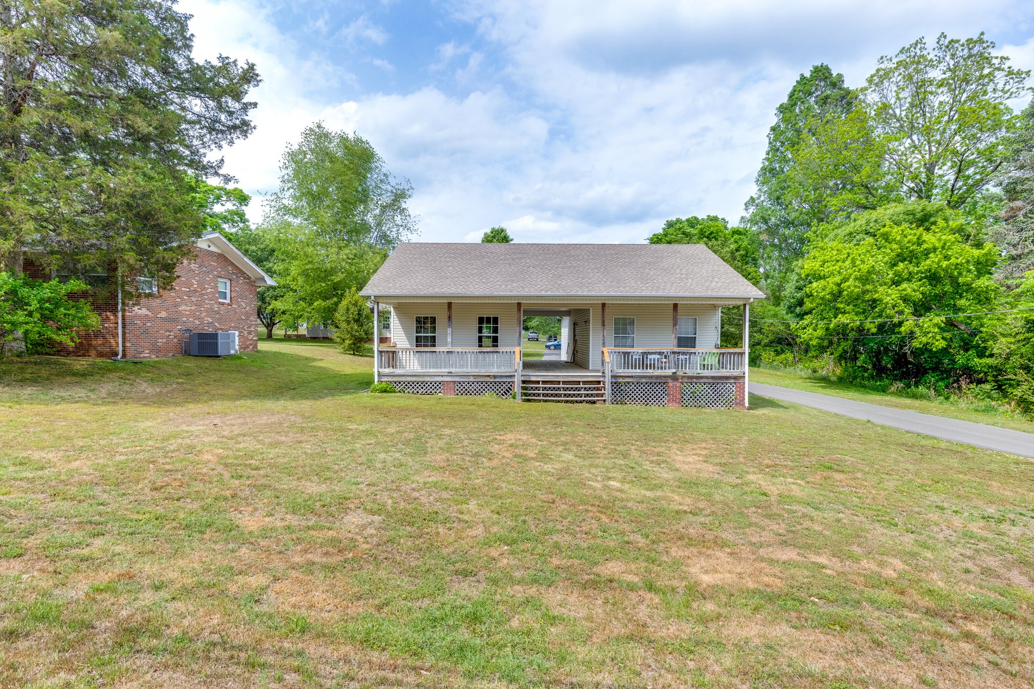 225 Locust Street Pulaski, TN 38478 - Photo 6 of 44 a front view of a house with swimming pool
