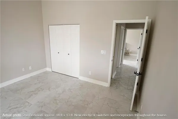 a bathroom with a toilet and a mirror