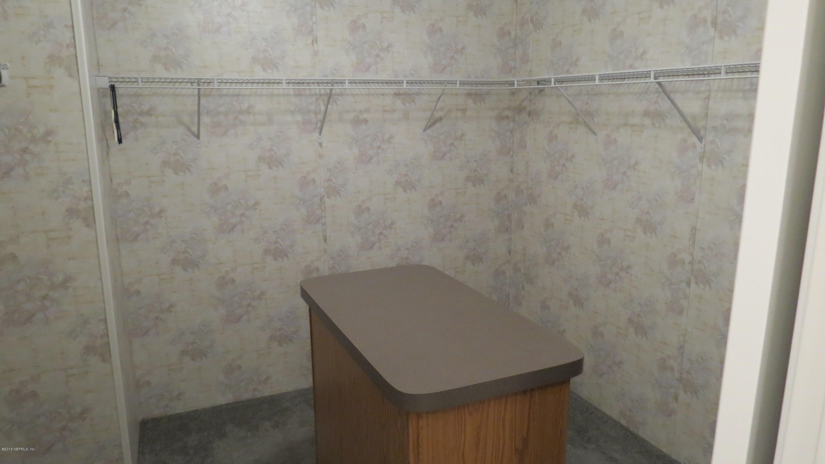 284 Beecher Springs Road Welaka, FL 32112 - Photo 31 of 36 a bathroom with a shower toilet and sink