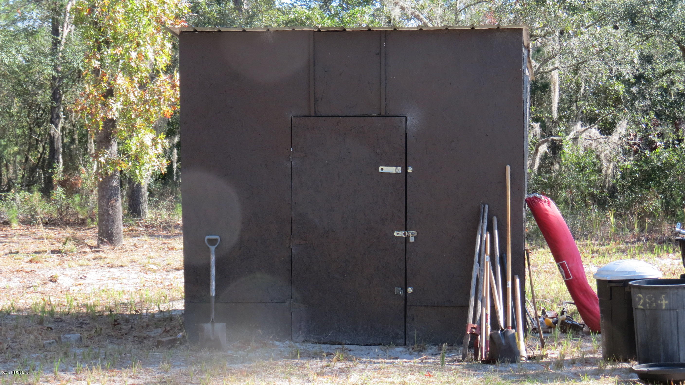 284 Beecher Springs Road Welaka, FL 32112 - Photo 6 of 36 a view of a wooden door