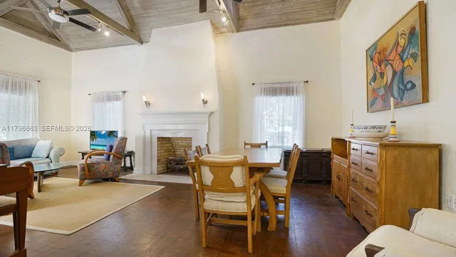 a view of a livingroom with furniture and a fireplace
