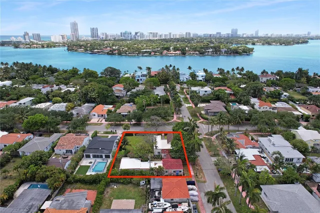 an aerial view of a city with lake view