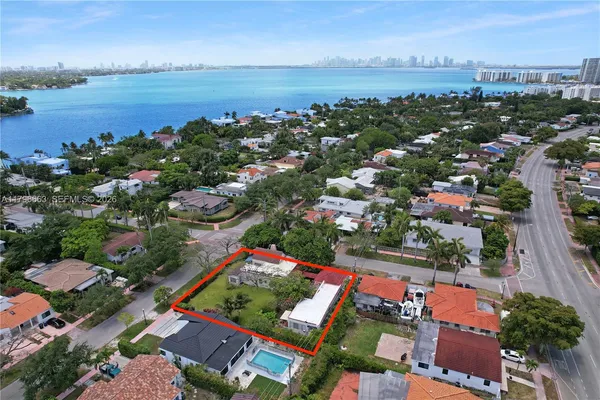 an aerial view of residential building and lake