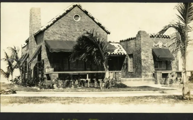 a view of a house and a yard