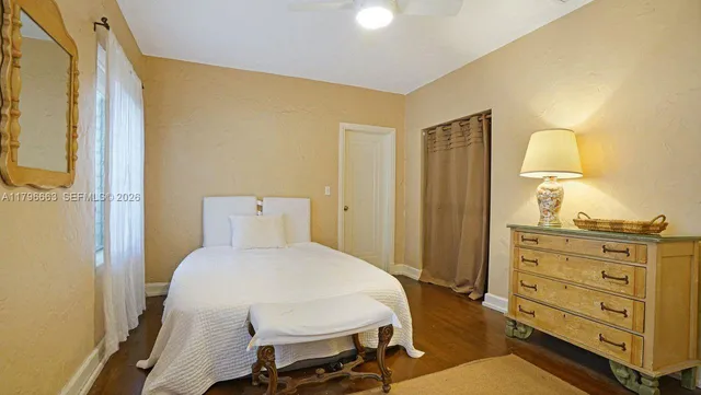 a bedroom with a bed and furniture