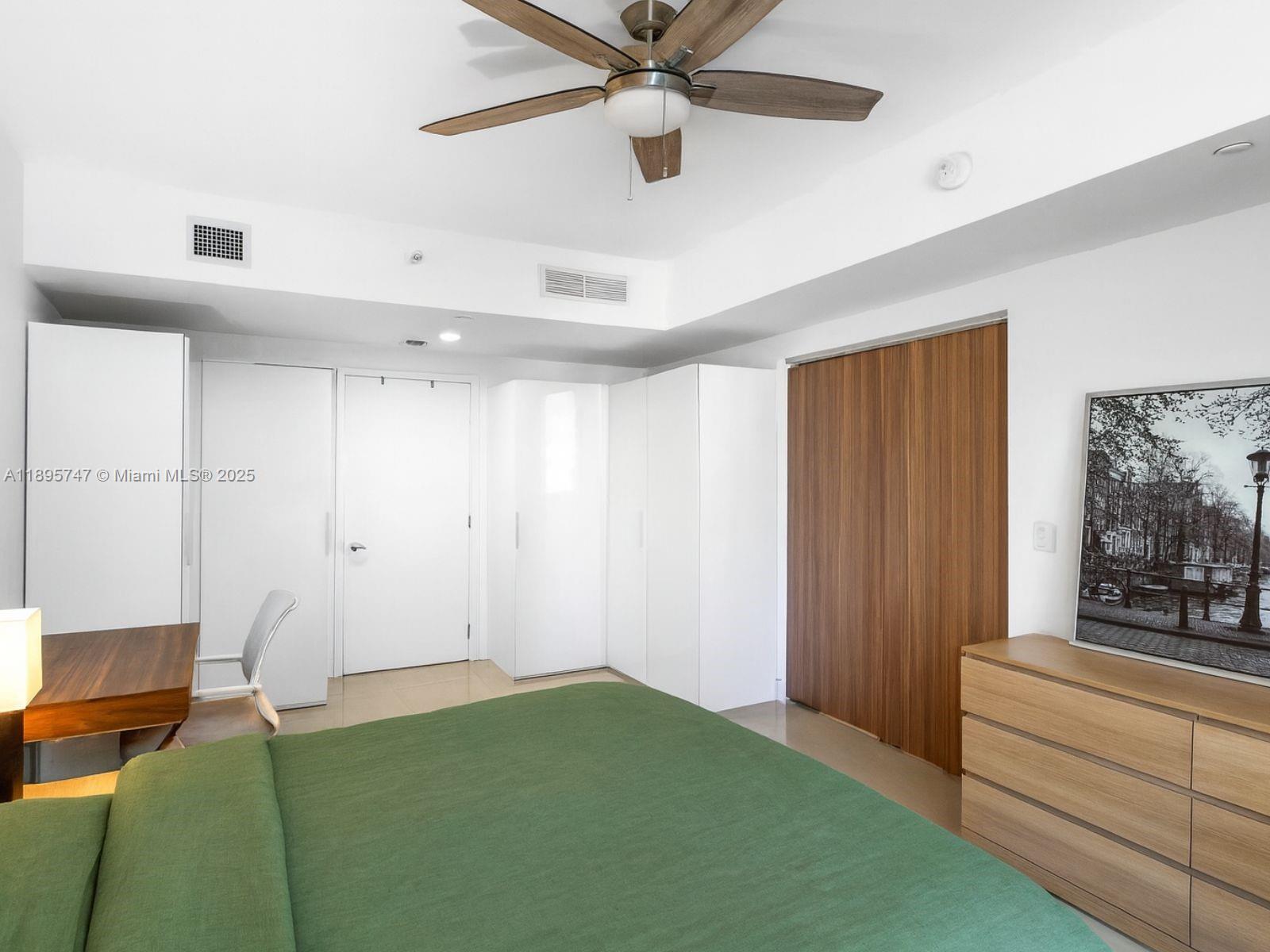 1010 Brickell Avenue, Unit 3208 Miami, FL 33131 - Photo 11 of 15 a bedroom with a bed and a window