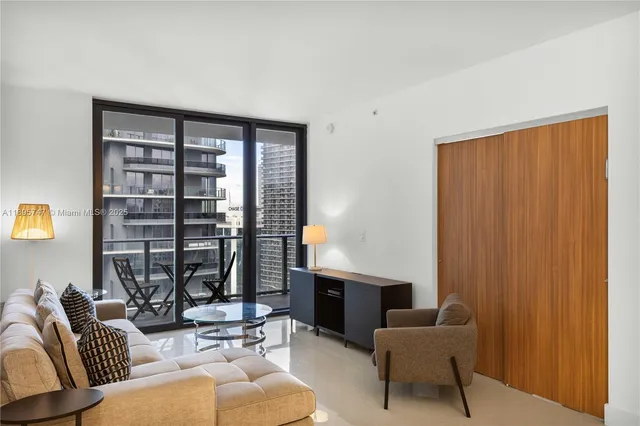 a living room with furniture and a window