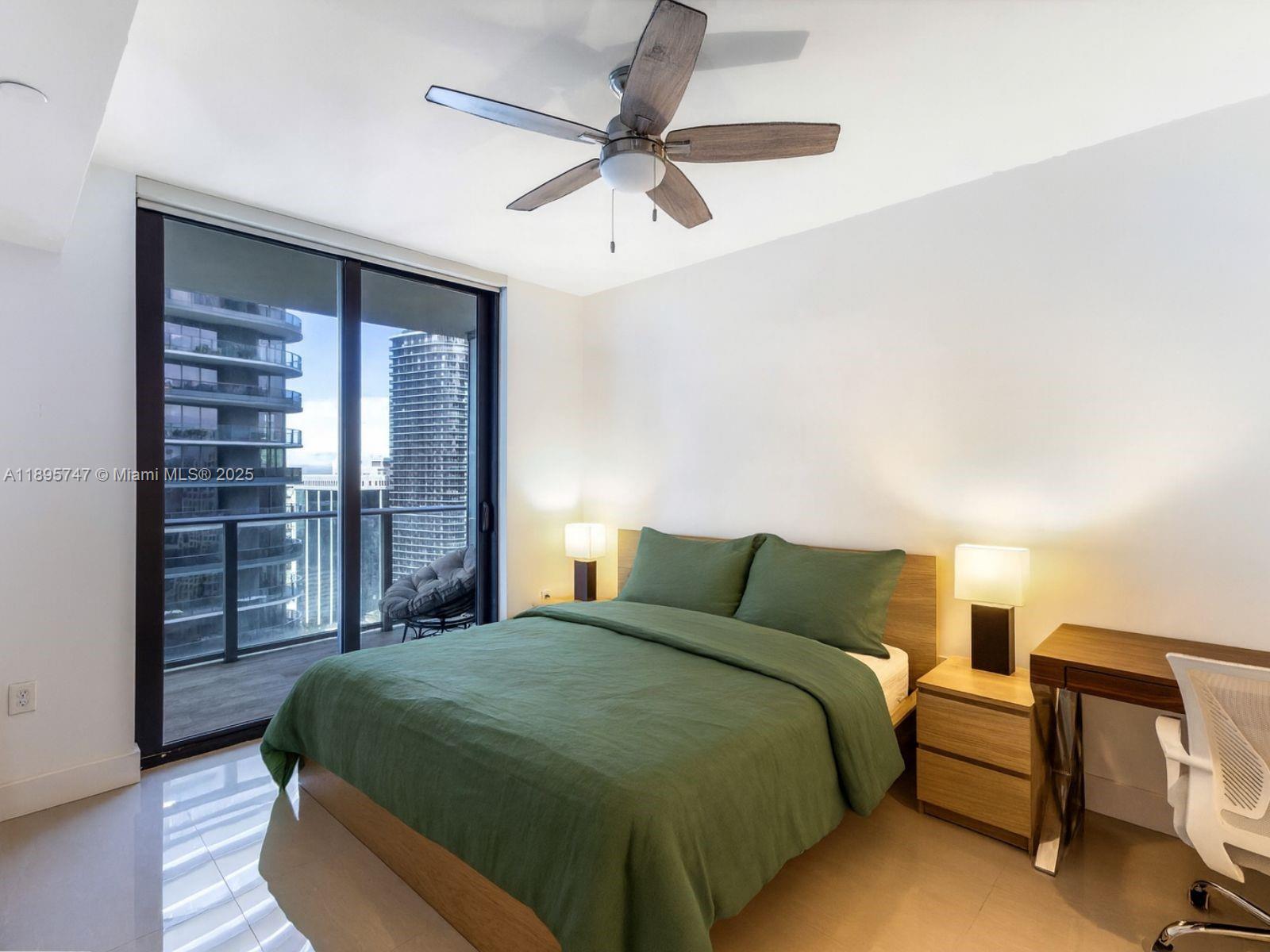 1010 Brickell Avenue, Unit 3208 Miami, FL 33131 - Photo 10 of 15 a bedroom with a bed and window