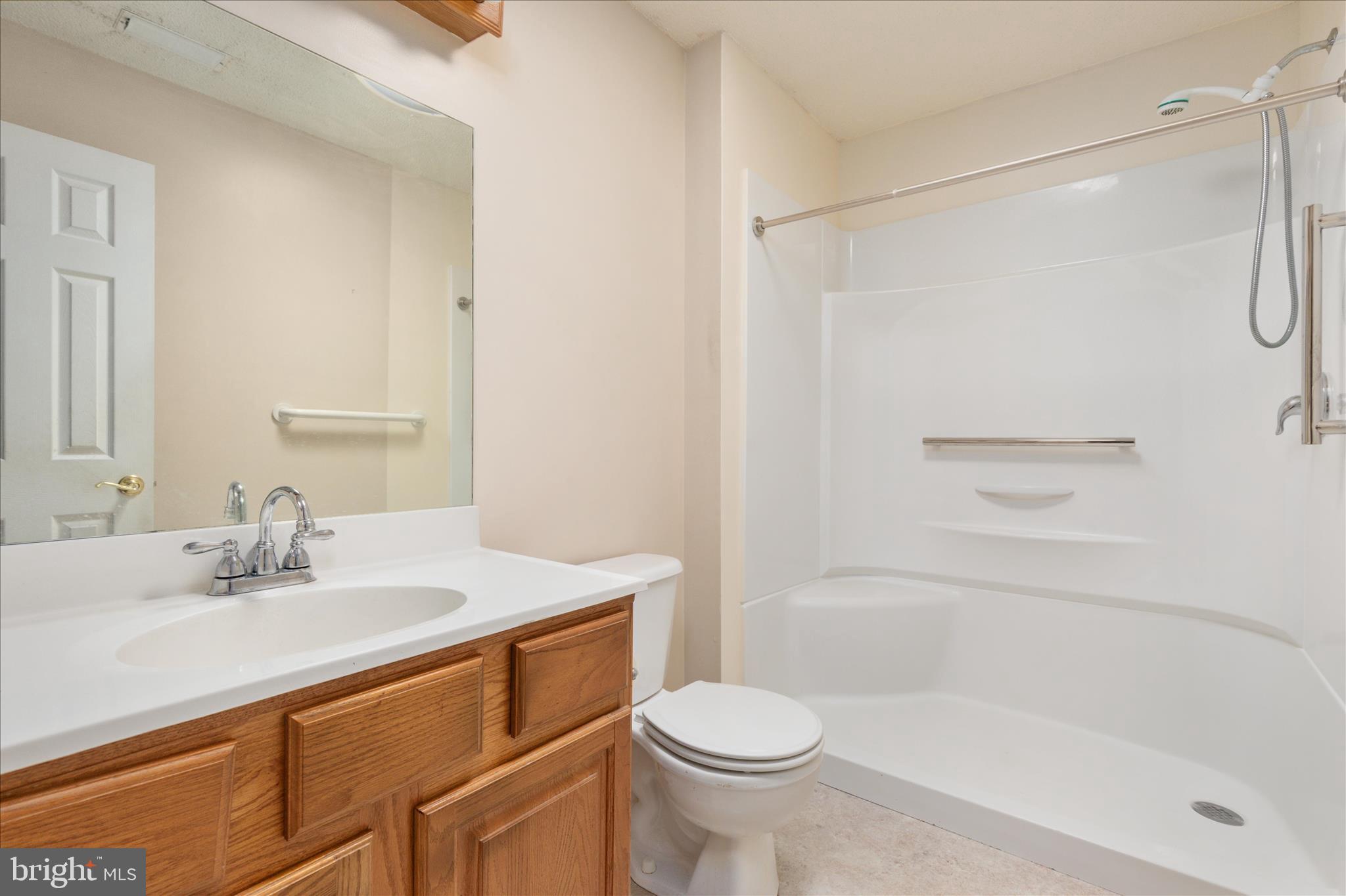205 Clyde Borum Road Inwood, WV 25428 - Photo 18 of 46 a bathroom with a sink toilet and shower