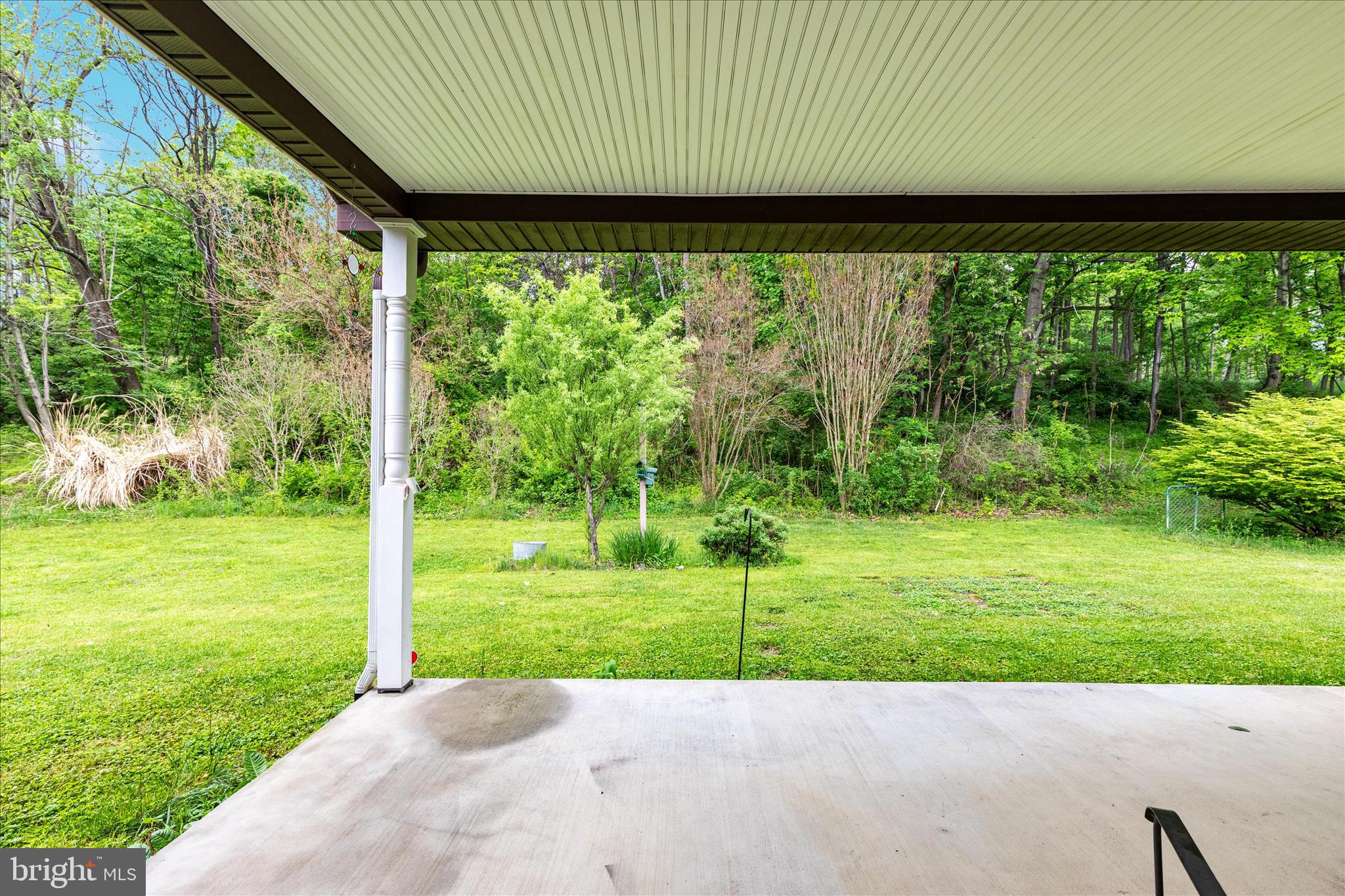 205 Clyde Borum Road Inwood, WV 25428 - Photo 28 of 46 a view of a backyard with a garden