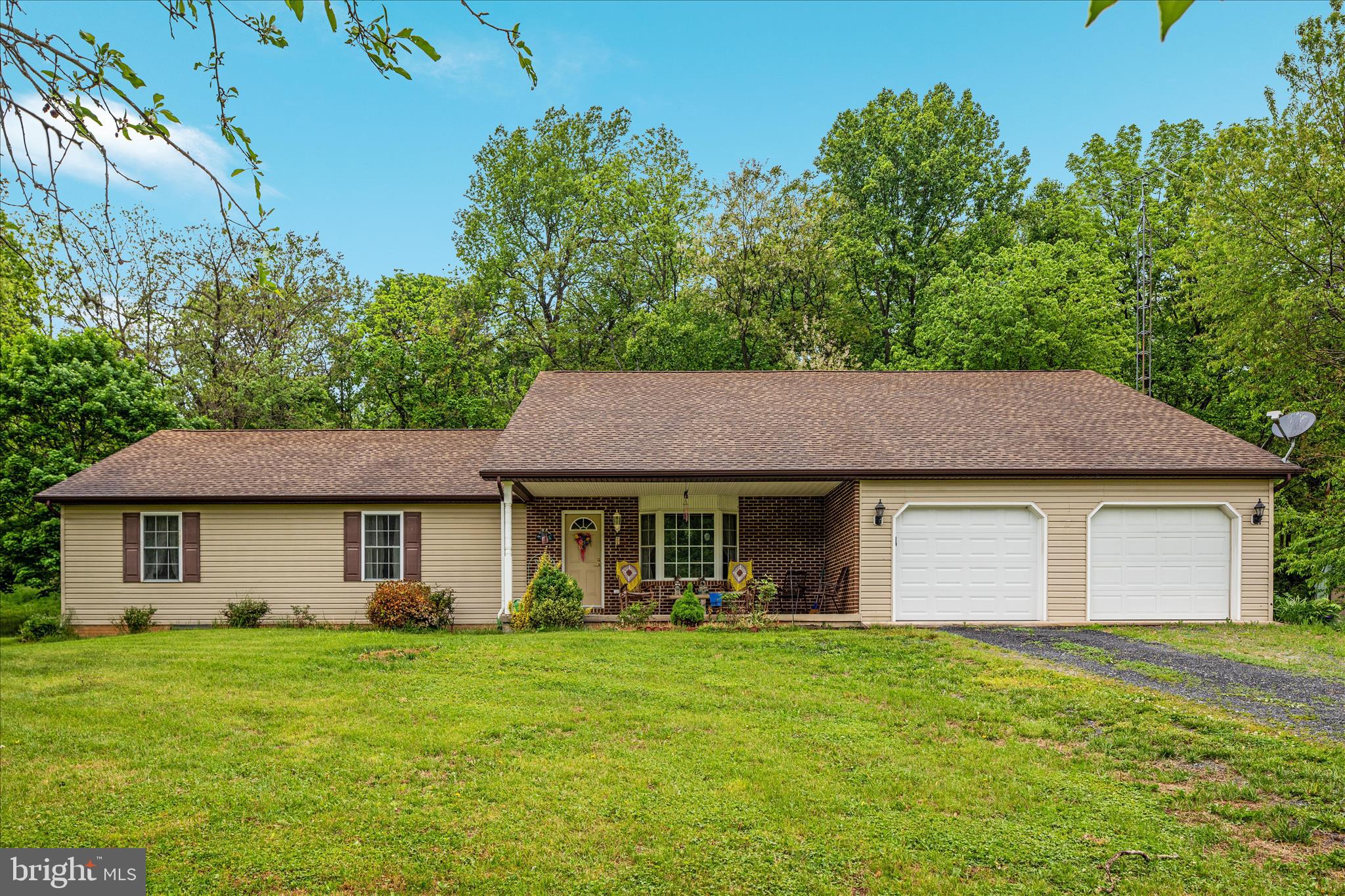 205 Clyde Borum Road Inwood, WV 25428 - Photo 36 of 46 a house view with a garden space