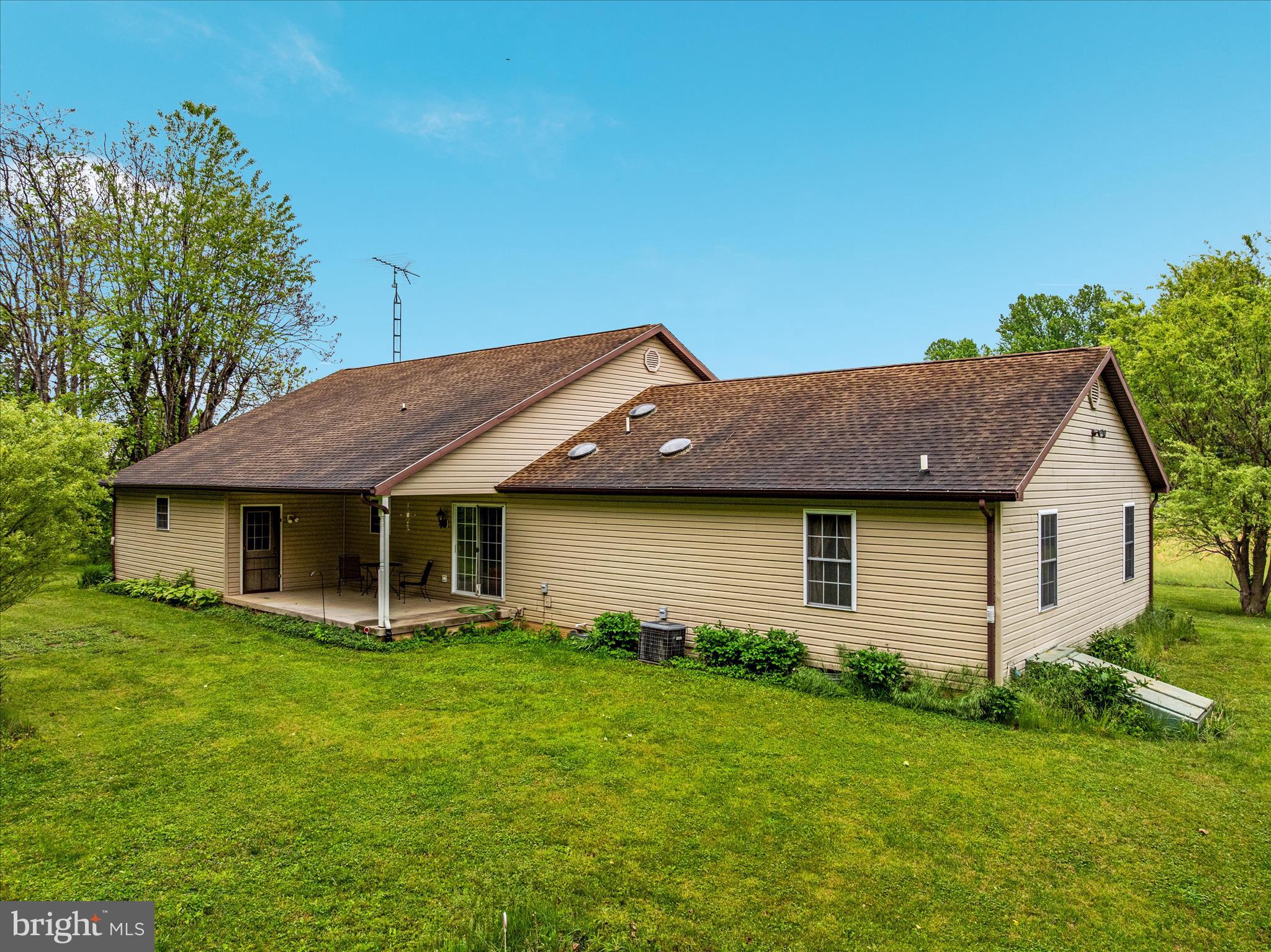 205 Clyde Borum Road Inwood, WV 25428 - Photo 43 of 46 a front view of house with yard and green space