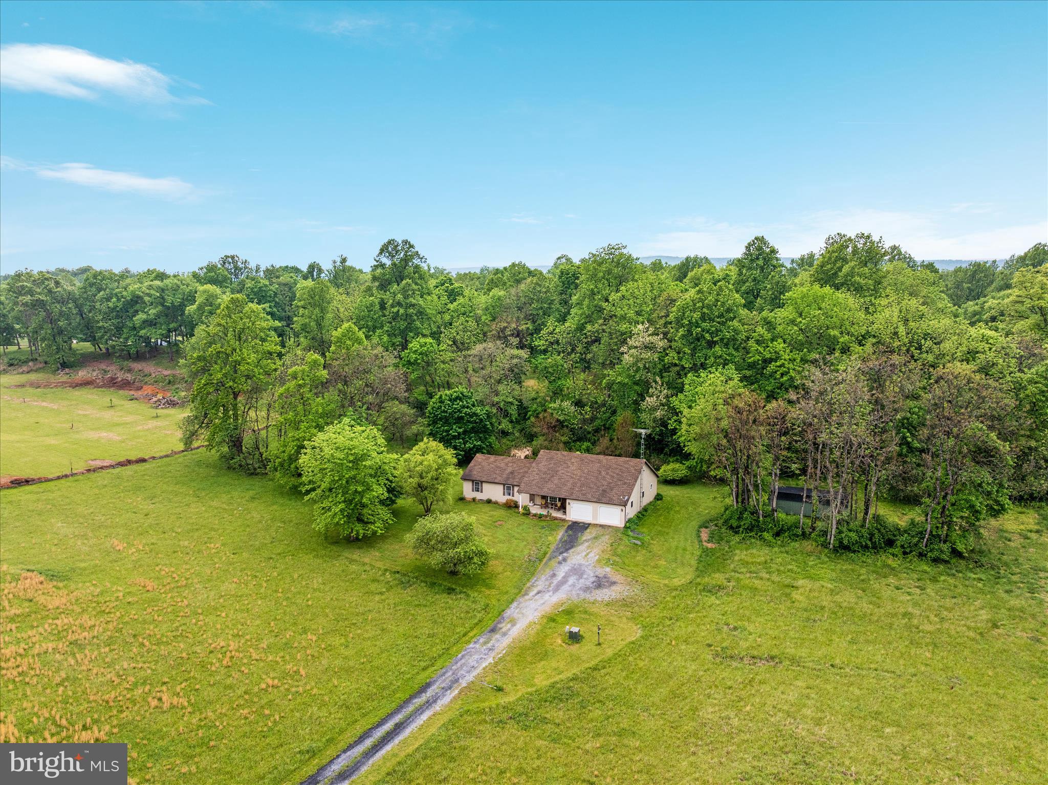 205 Clyde Borum Road Inwood, WV 25428 - Photo 5 of 46 a view of a lake with a big yard