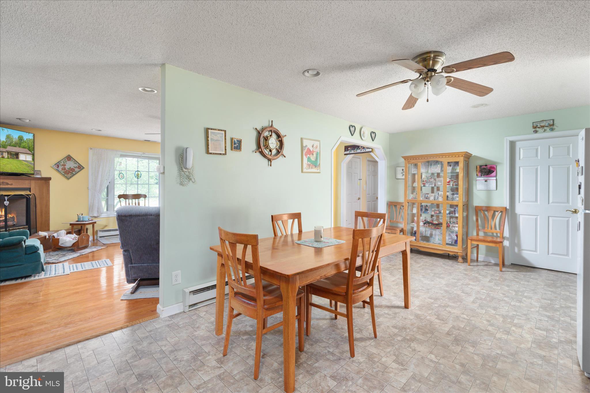 205 Clyde Borum Road Inwood, WV 25428 - Photo 9 of 46 a view of a livingroom with furniture and a ceiling fan
