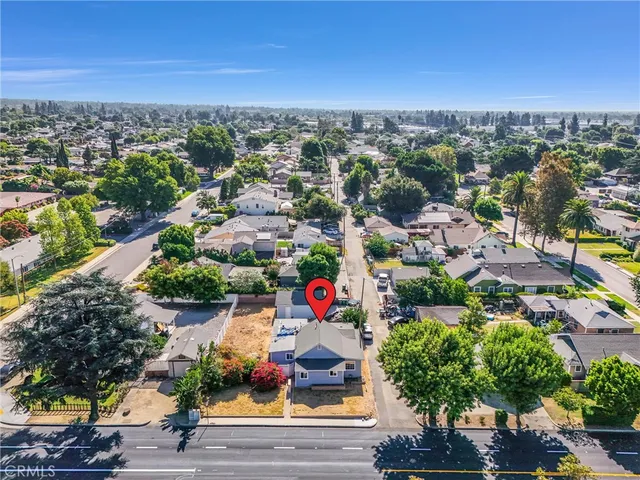 an aerial view of residential houses with outdoor space
