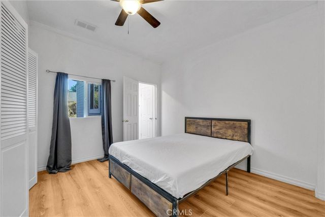 a bedroom with a bed and a table