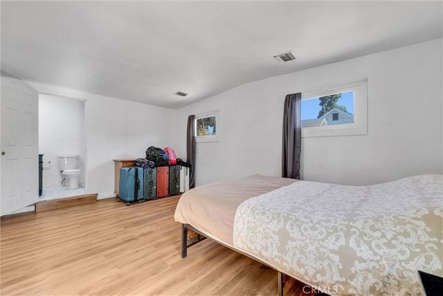 a bedroom with a bed and a closet