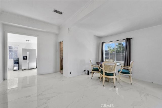 a view of a livingroom with furniture and wooden floor