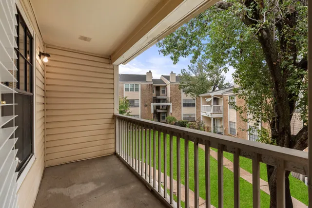a view of a car parked in front of a building