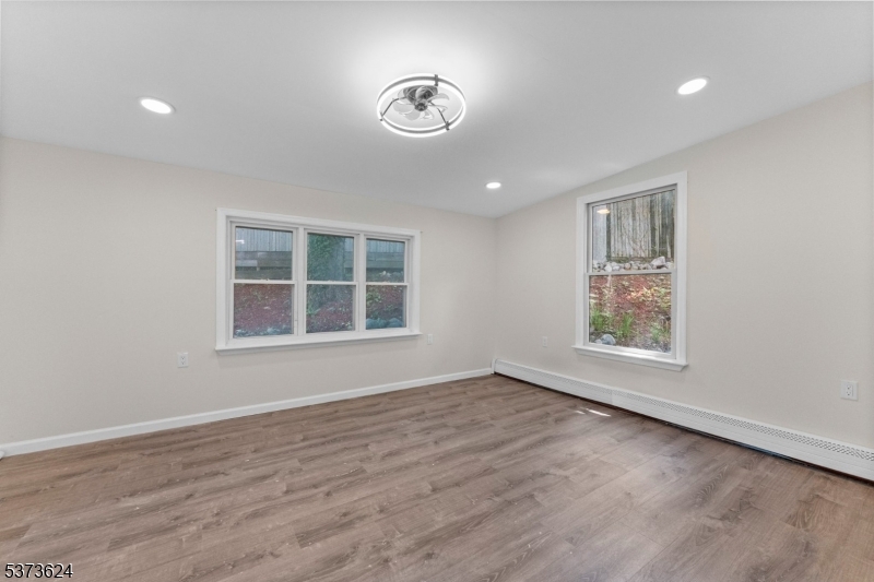 113 Rt560 Layton, NJ 07851 - Photo 11 of 17 an empty room with wooden floor and windows