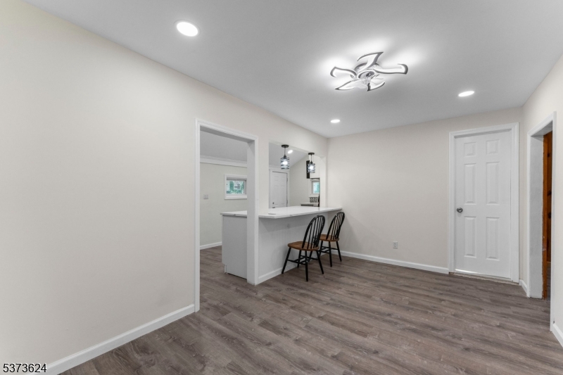 113 Rt560 Layton, NJ 07851 - Photo 12 of 17 a view of a livingroom and a kitchen with a hardwood floor