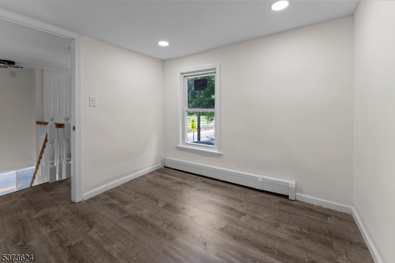 113 Rt560 Layton, NJ 07851 - Photo 13 of 17 an empty room with wooden floor and windows