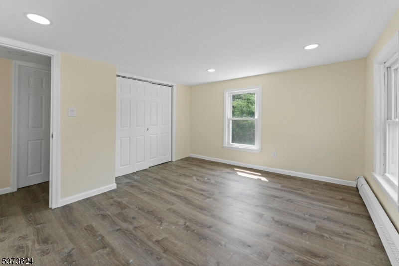 113 Rt560 Layton, NJ 07851 - Photo 14 of 17 an empty room with wooden floor and windows