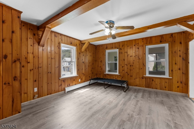 113 Rt560 Layton, NJ 07851 - Photo 5 of 17 a view of an empty room with a window and wooden floor