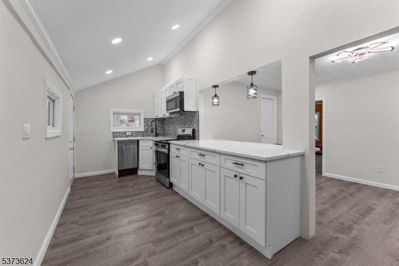 113 Rt560 Layton, NJ 07851 - Photo 8 of 17 a large kitchen with stainless steel appliances granite countertop a stove and a sink