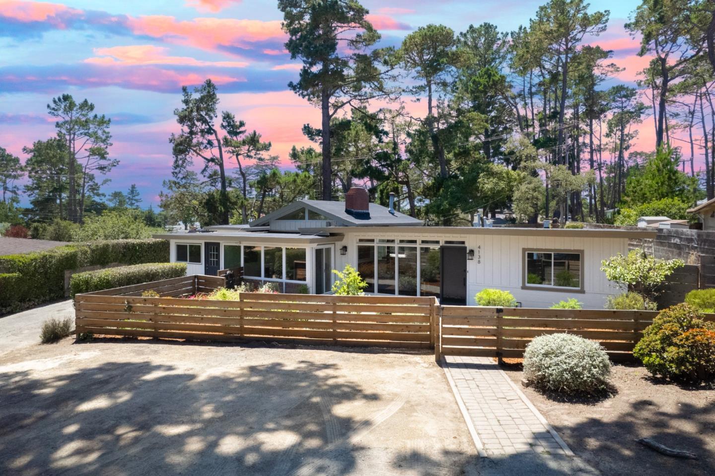 4138 Crest Road Pebble Beach, CA 93953 - Photo 1 of 38 a front view of a house with a yard