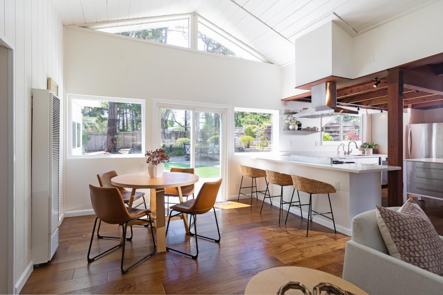 4138 Crest Road Pebble Beach, CA 93953 - Photo 14 of 38 a dining room with furniture a rug and wooden floor