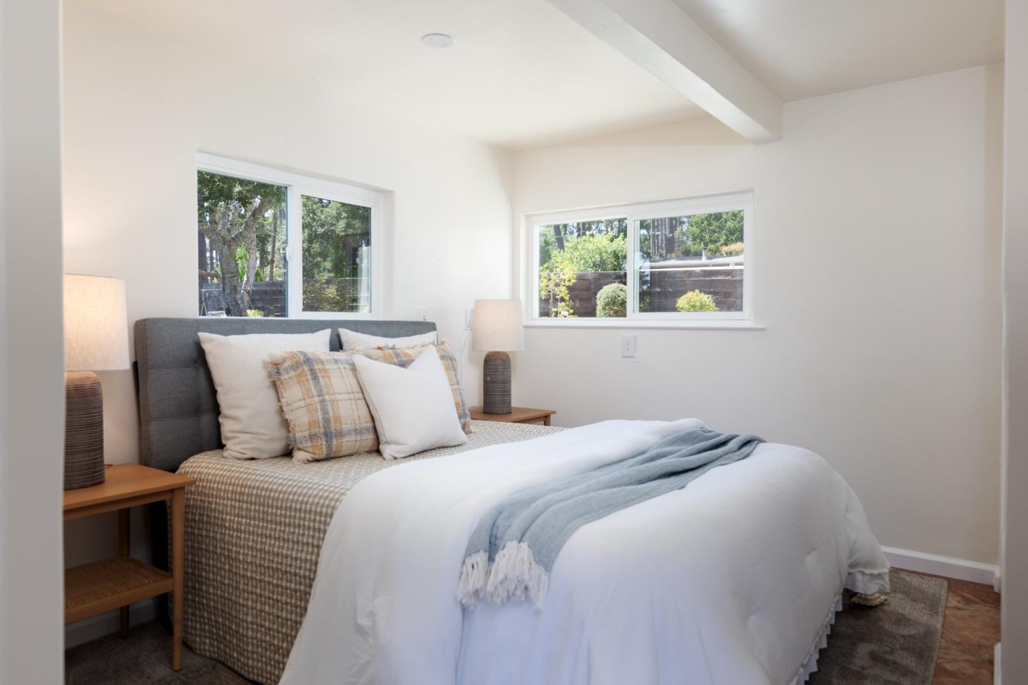 4138 Crest Road Pebble Beach, CA 93953 - Photo 17 of 38 a bedroom with a large bed and a window