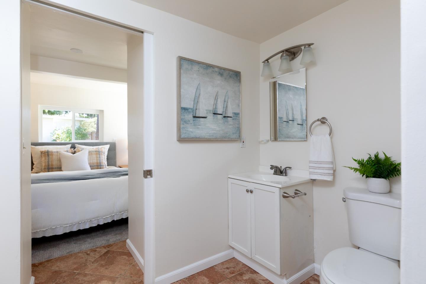 4138 Crest Road Pebble Beach, CA 93953 - Photo 18 of 38 a bathroom with a sink toilet and mirror