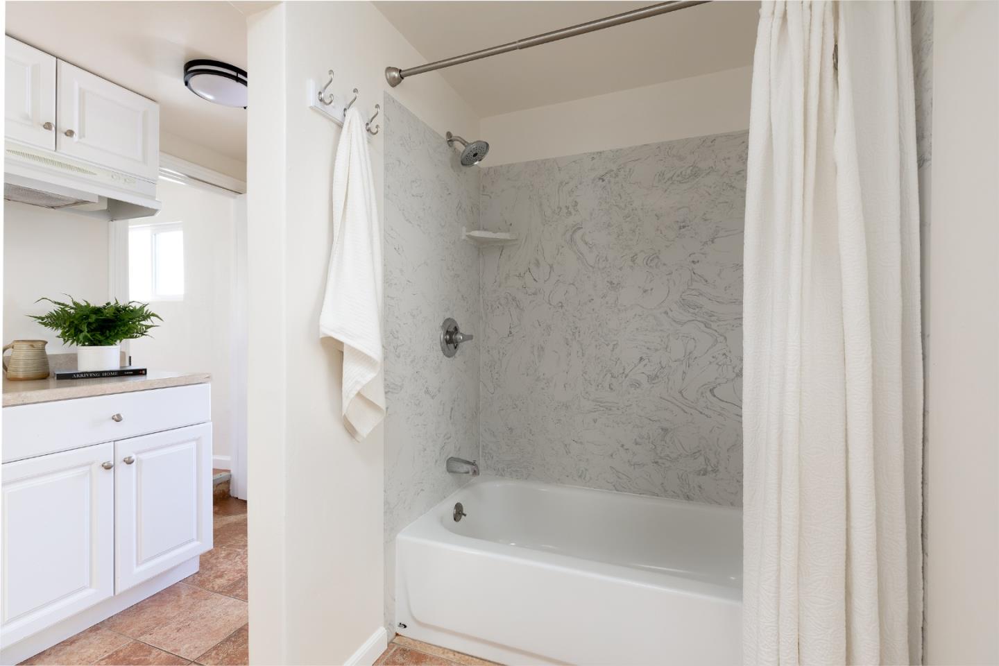 4138 Crest Road Pebble Beach, CA 93953 - Photo 19 of 38 a bathroom with a bathtub and a shower