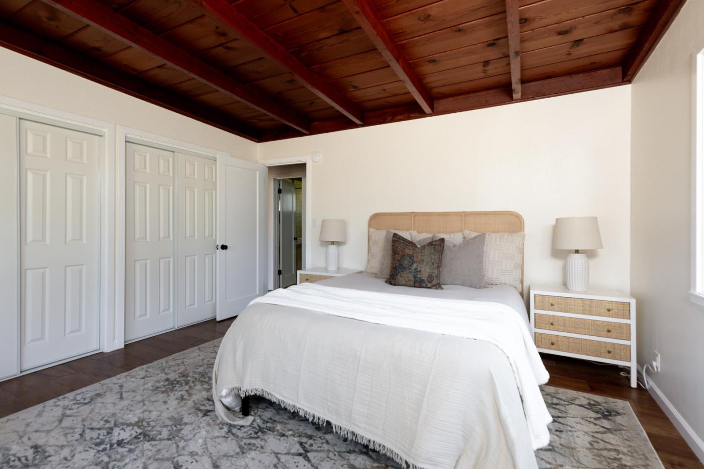 4138 Crest Road Pebble Beach, CA 93953 - Photo 23 of 38 a spacious bedroom with a bed and a cabinet