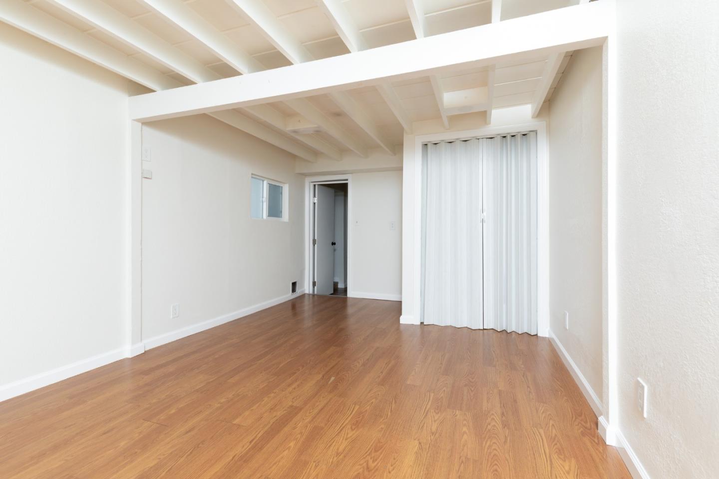 4138 Crest Road Pebble Beach, CA 93953 - Photo 26 of 38 a view of an empty room with wooden floor