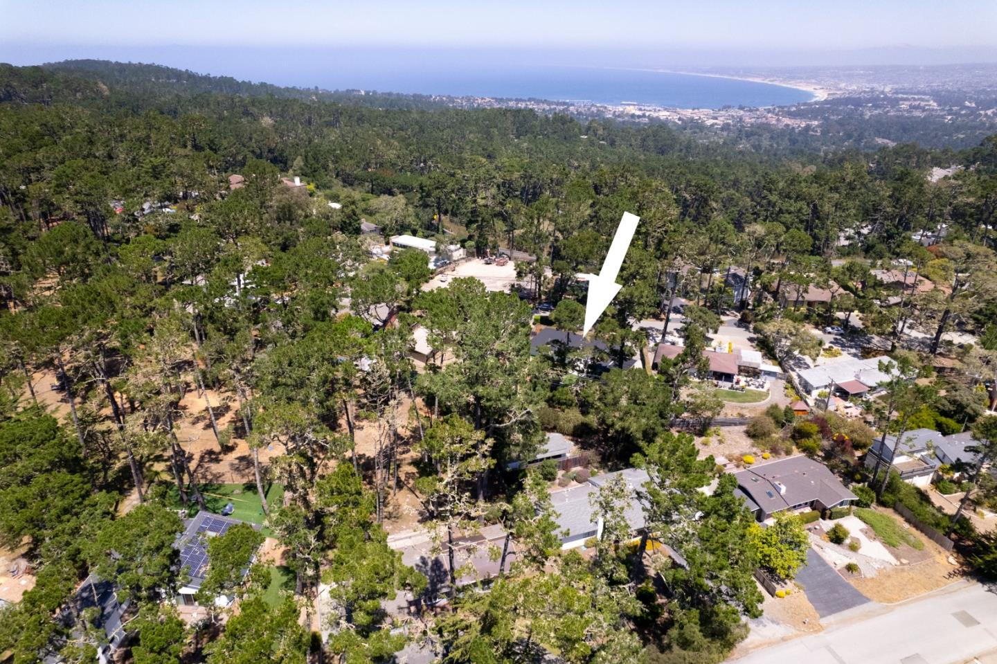 4138 Crest Road Pebble Beach, CA 93953 - Photo 34 of 38 an aerial view of a houses with a lush green hillside