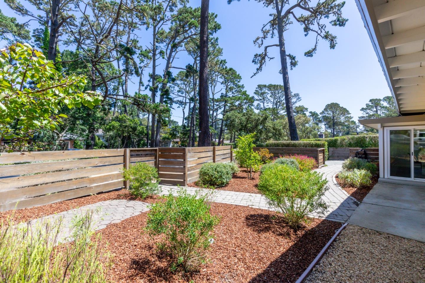 4138 Crest Road Pebble Beach, CA 93953 - Photo 4 of 38 a view of a garden with potted plants