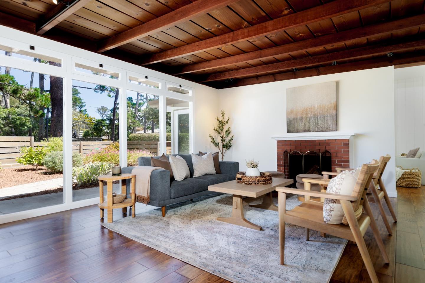 4138 Crest Road Pebble Beach, CA 93953 - Photo 6 of 38 a living room with furniture a fireplace and a table