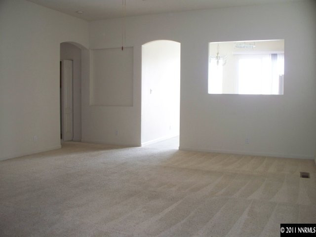 10065 Silver Star Drive Reno, NV 89521 - Photo 2 of 13 an empty room with windows